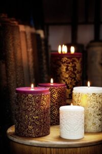 purple and ivory pillar candles and décor