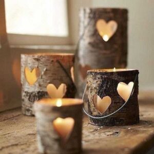 pillar candles in wooden holders with heart décor