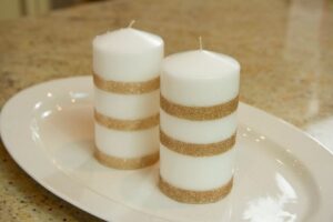 white Pillar candles in white tray