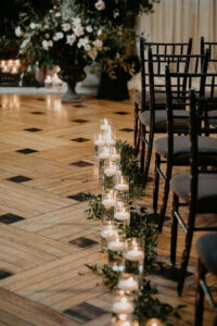 indoor wedding aisle-ideas with-candles and greenery