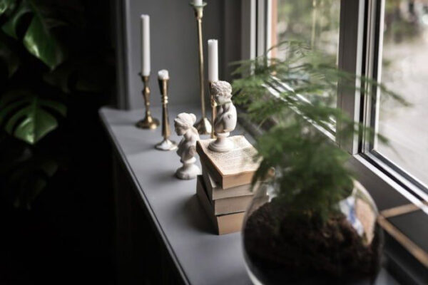 taper candles on the window sill 1
