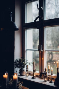taper candles on the window sill