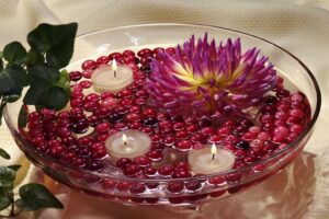 Floating candle with cranberry