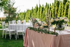 Wedding party in garden with wedding candle holders