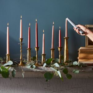 colorful taper candles and candlesticks