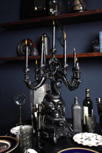 black candle holder with skulls 