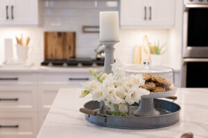 kitchen interior design with pillar candle and flowers 