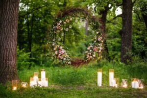 garden decoration with candles and flowers for wedding photoshoot