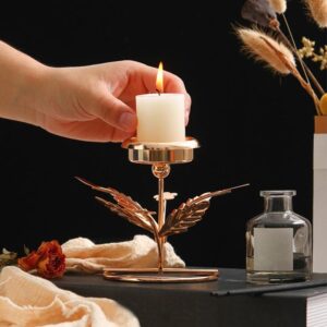 pillar candle on modern iron candlestick 