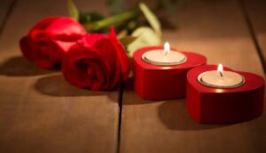 tealight candles in red candleholders with roses for Valentine's day