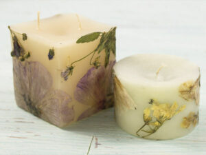 decorating candles with dried flowers 