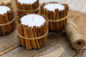 wax candles with cinnamon sticks