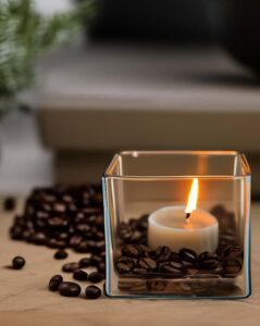 tealight candle in jar with coffee beans 