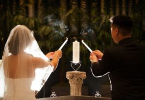 the newly weds holding unity candles 