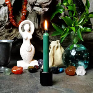 green taper burning candle