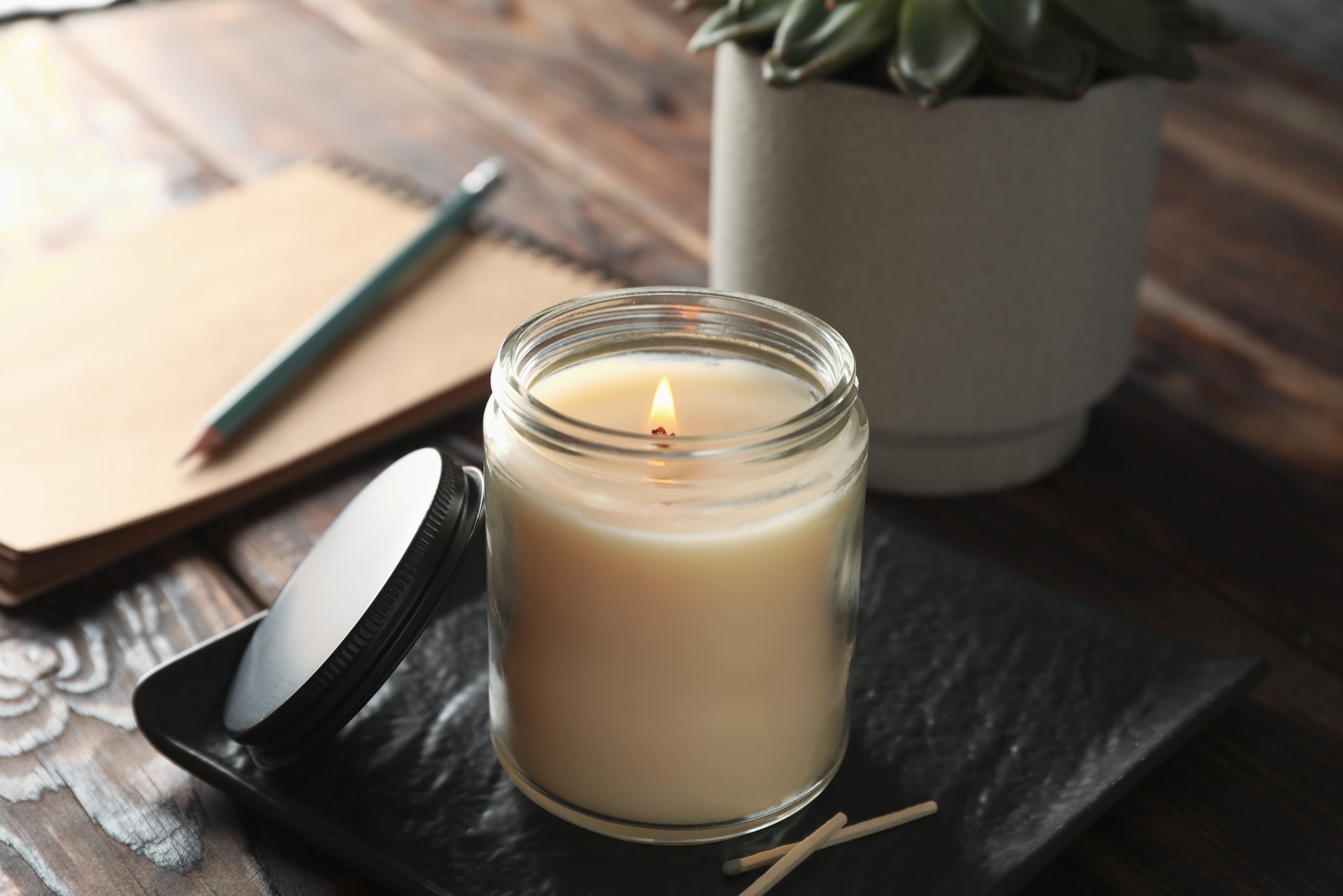 burning aromatherapy candle in a jar