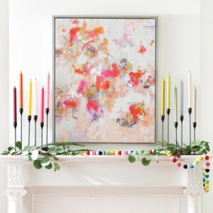 colorful taper candles on the fireplace 