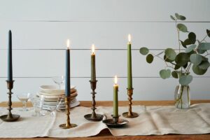 tall candles on kitchen table 