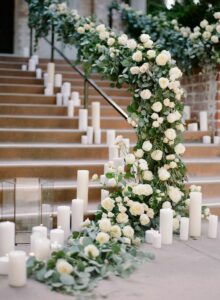 Stairs decorated with pillar wedding candles 