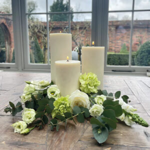 pillar candles with flowers for wedding table decoration 
