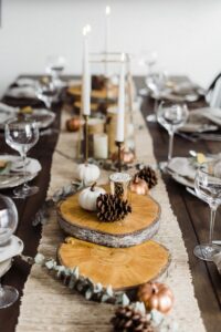 rustic Thanksgiving table decoration with taper candles and pines 