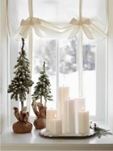 Christmas pillar candles on tray for windowsills decoration 