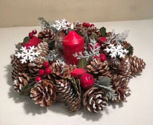 Christmas table wreath with pine cones and candle 
