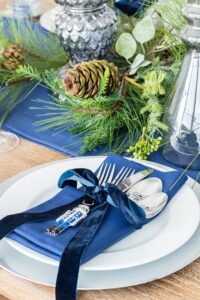 Silverware with a ribbon tied for Christmas table decoration 