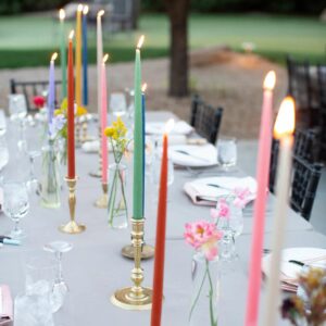 Formal dinners with tall colorful candles 