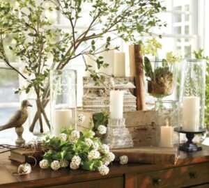 spring decoration with flowers and pillar candles 