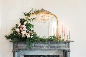 taper candles and flowers for fireplace decoration 