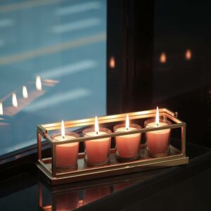 small candles in holders placed on the tray