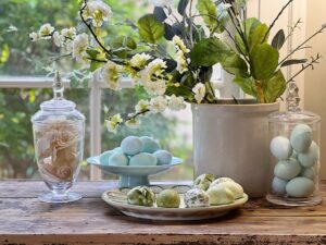 jars, flowers, and eggs for Easter table centerpiece 