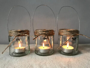 tealight burning candles in jar lanterns 